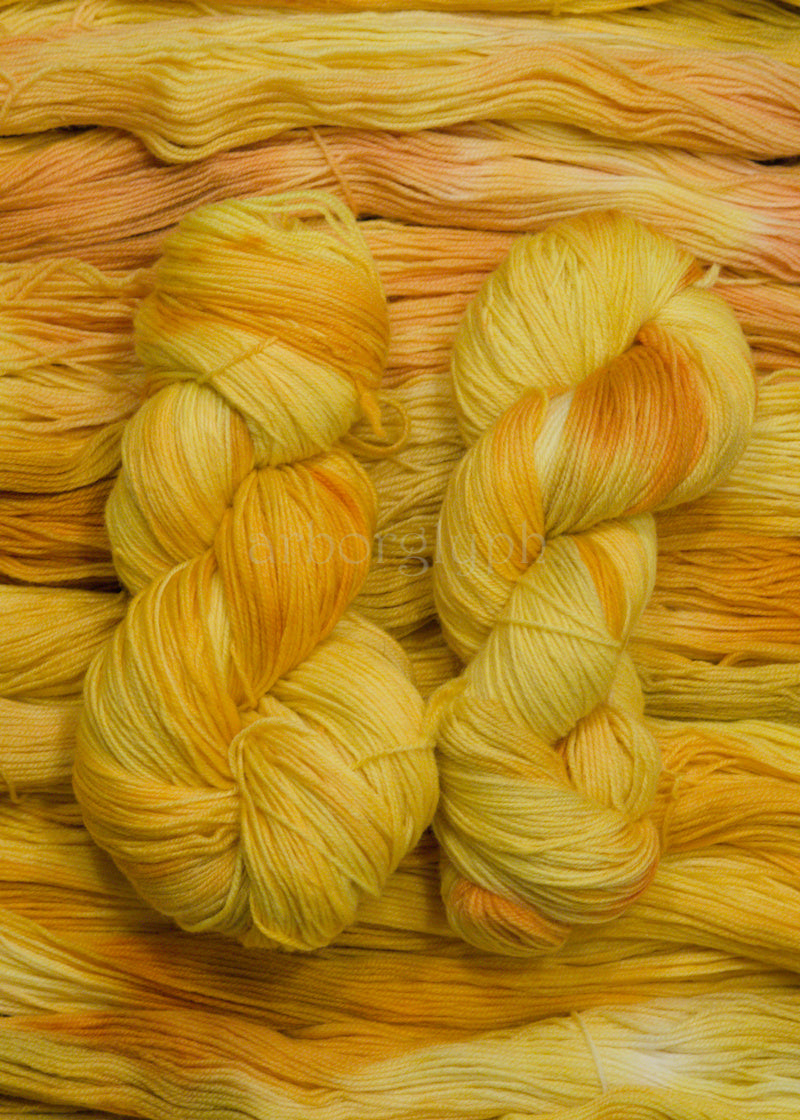 Close-up of yellow and orange yarn skeins
