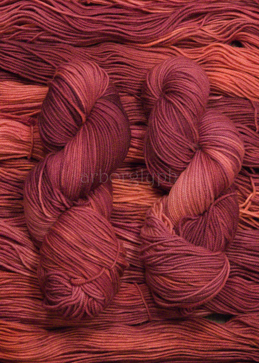 Close-up of skeins of red yarn with a blurred background