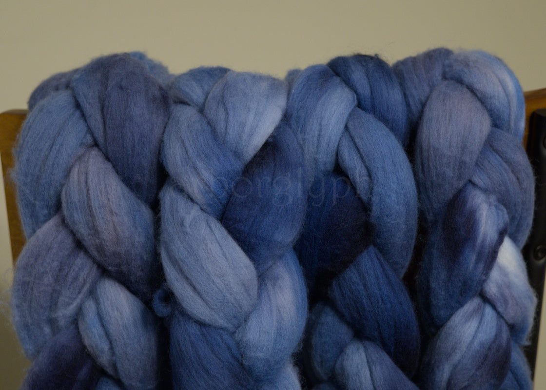 Braided blue Merino wool top on a chair