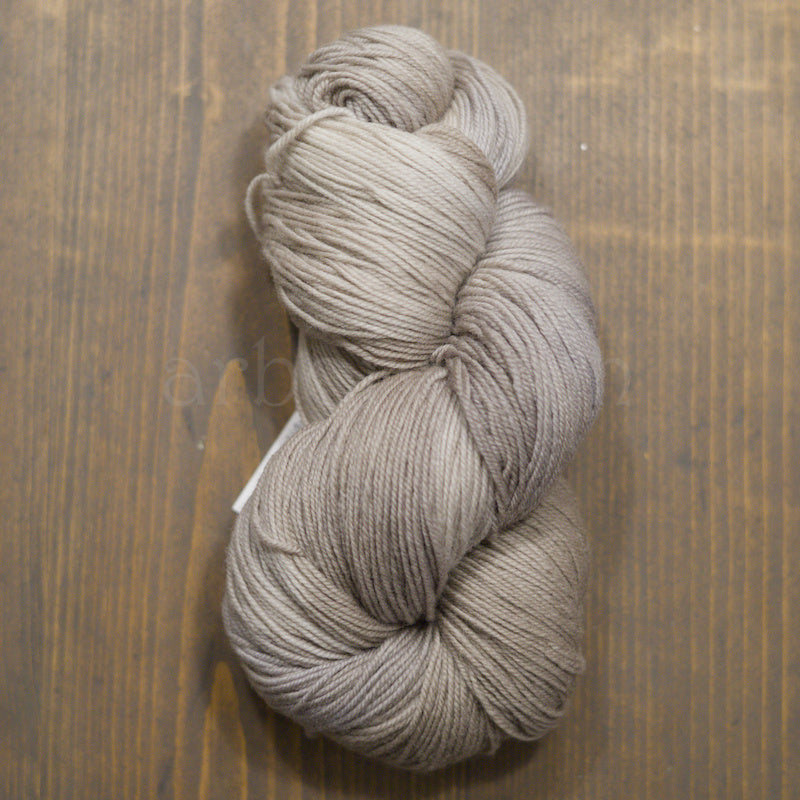Skein of Hand dyed Shaniko yarn in shades of gray