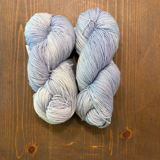 hand dyed skeins of Merino/Silk blend yarn in a light blue/violet