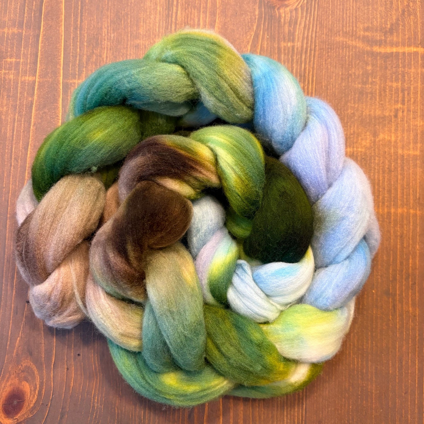Braid of hand-dyed combed top in blue and green Merino wool